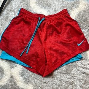 Nike red and blue dri fit shorts in a size small